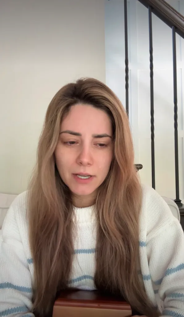 A woman, teary-eyed, mourning the death of her social media dog, Tucker Budzyn.
