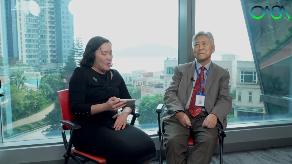 A woman interviewing Professor CK Shum for the Space Economy Association Hong Kong.