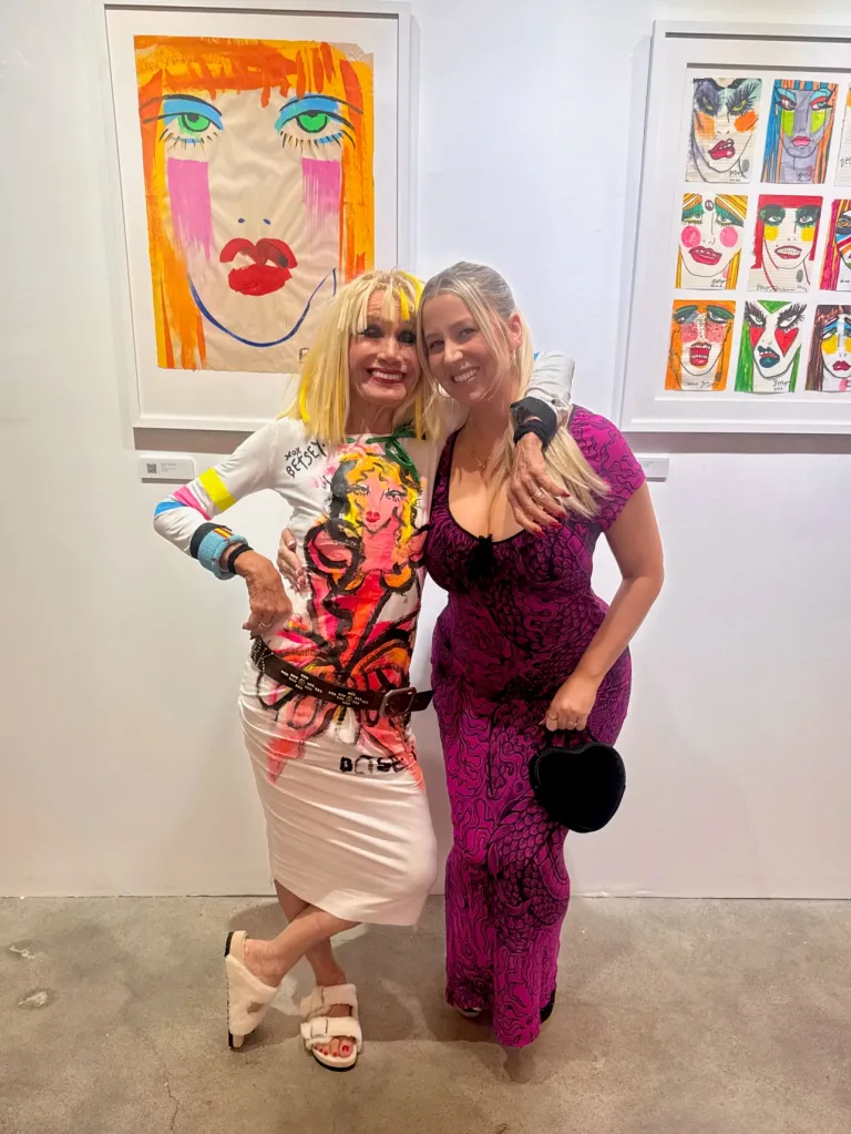 Betsey Johnson fashion collector Steph Ermer and another woman smiling.