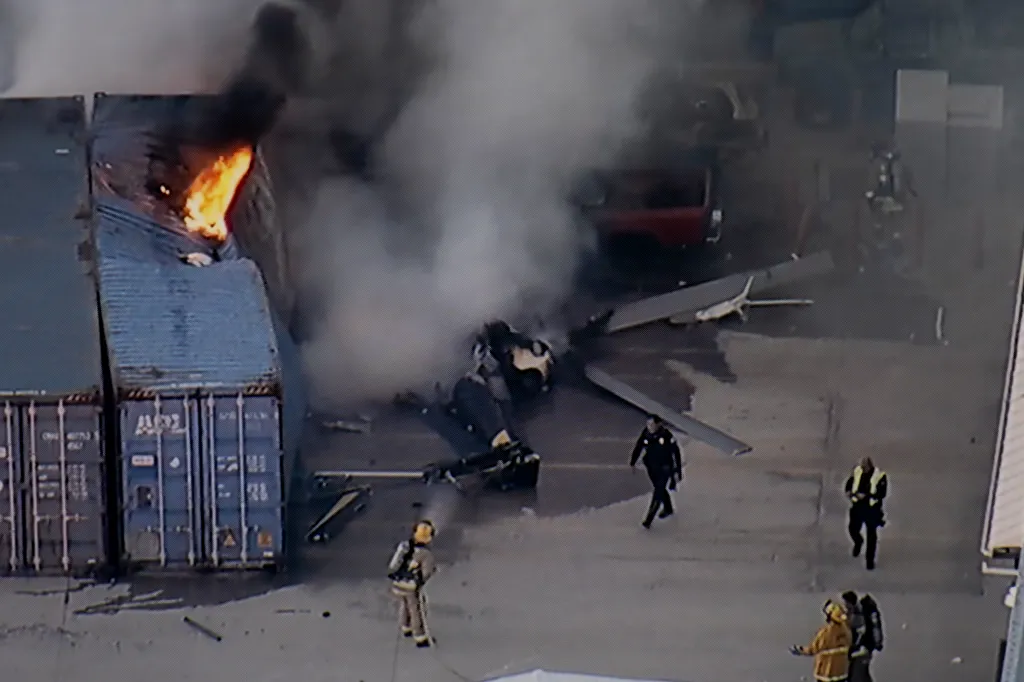 First responders work the scene after a helicopter crashed near a bus crash in the Chatsworth neighborhood of Los Angeles.