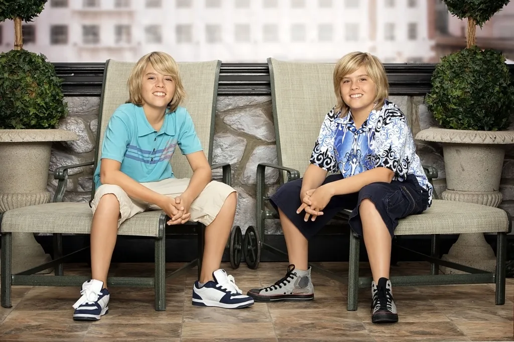Dylan and Cole Sprouse sitting in chairs.