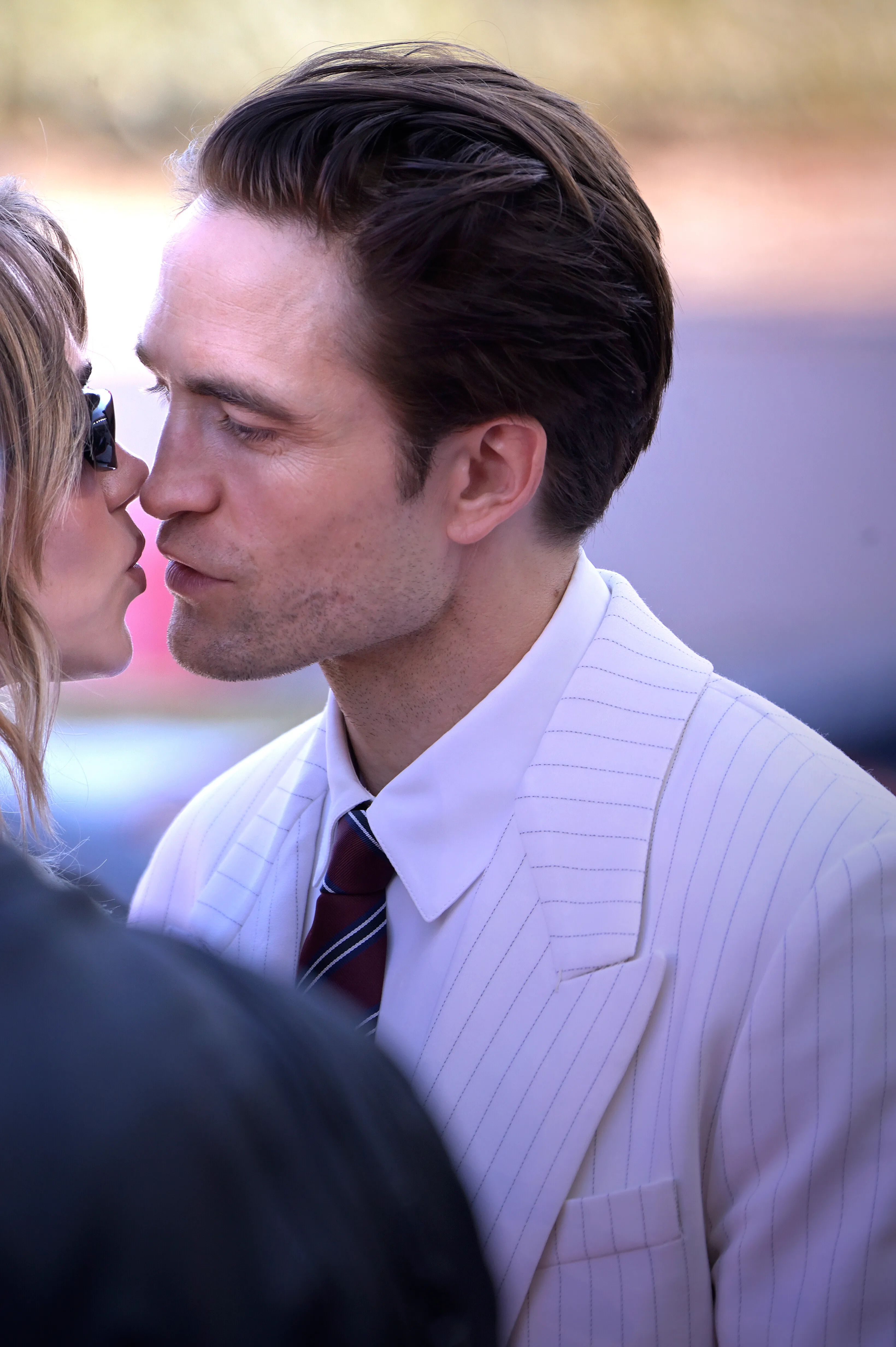 Robert Pattinson and Suki Waterhouse kissing at the Venice International Film Festival.