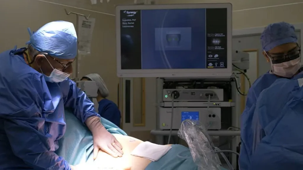 Surgeons begin a kidney transplant procedure in an operating room.