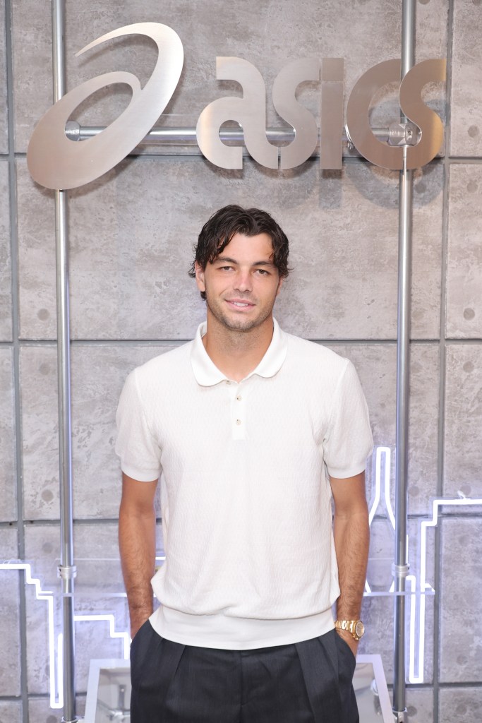 Tennis player Taylor Fritz poses for a photo at the ASICS House Of Tennis player reception.