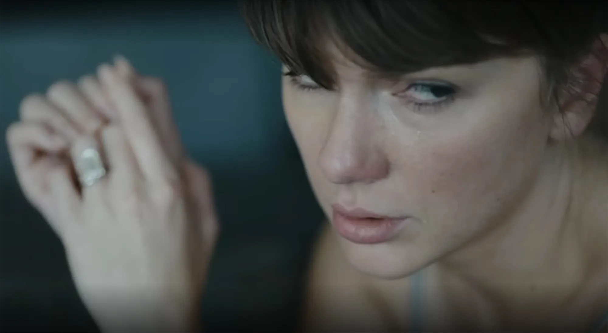 Taylor Swift with tearful eyes.