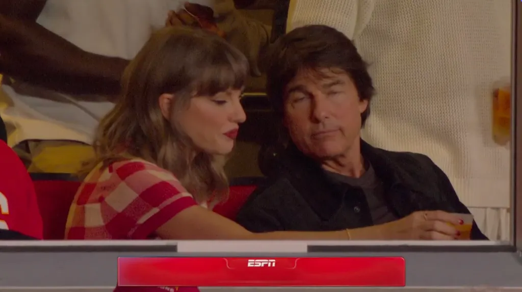 Taylor Swift and Tom Cruise sitting together at a Chiefs game.