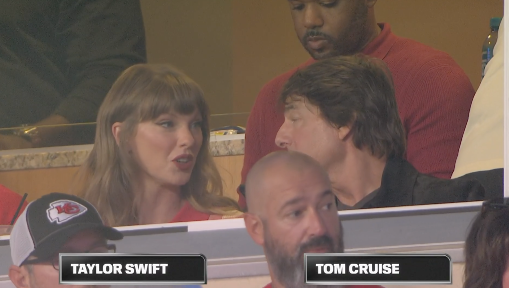 Taylor Swift and Tom Cruise sitting next to each other at a Chiefs game.