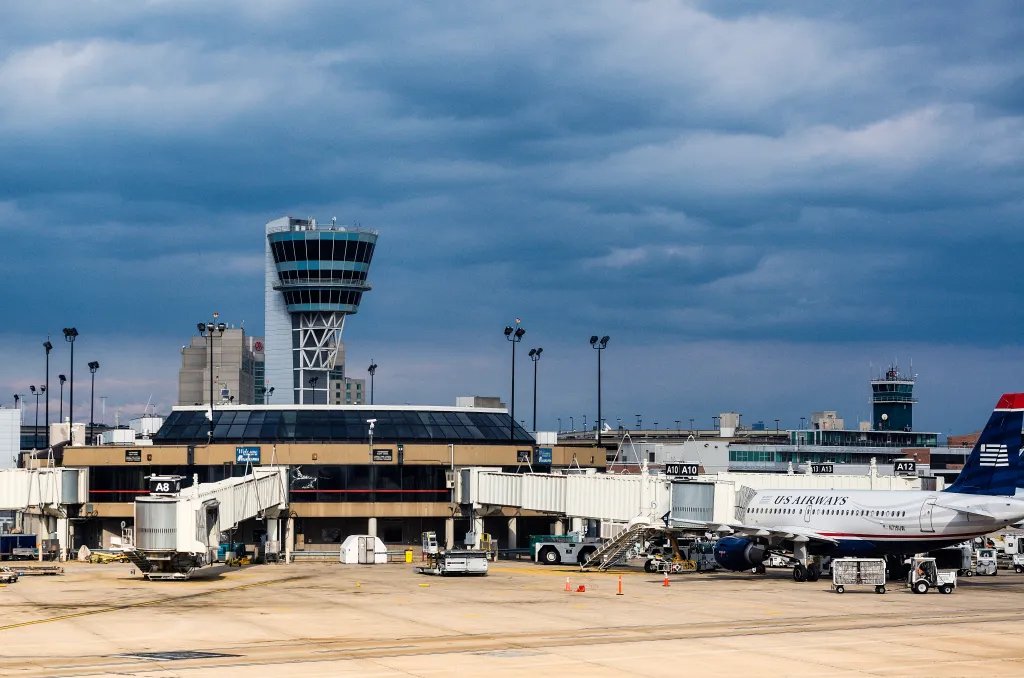 Philadelphia International Airport terminal and control tower with a US Airways plane.