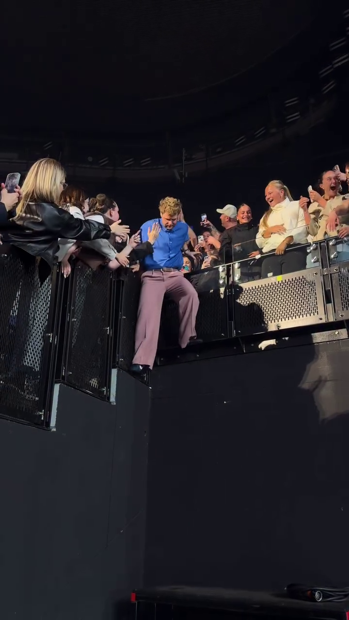 Alex Warren stands with the crowd during his concert at Rod Laver Arena in Melbourne, Australia, on Sept. 4, 2026.