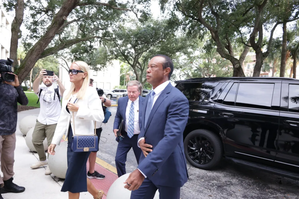 Tiger Woods and Vanessa Trump arriving at court.
