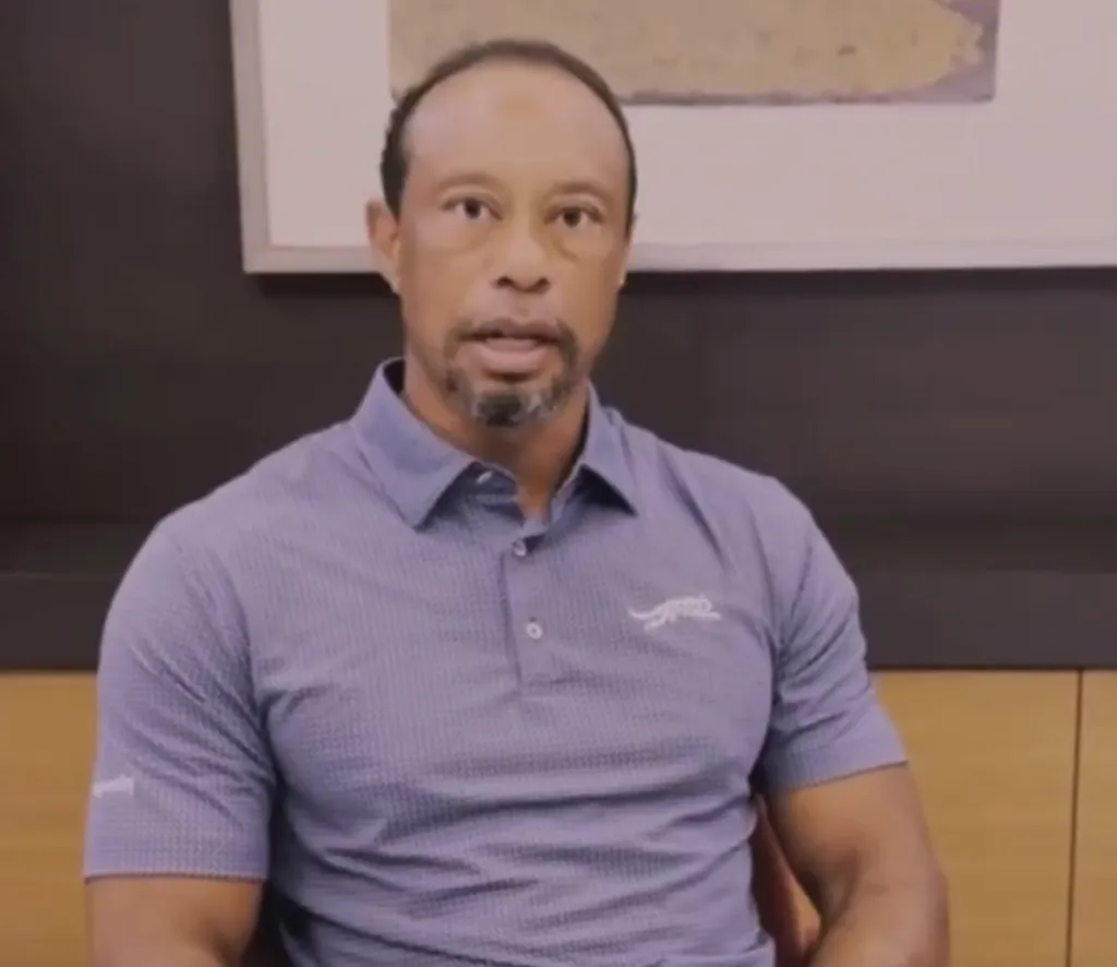Golfer Tiger Woods in a blue polo shirt.