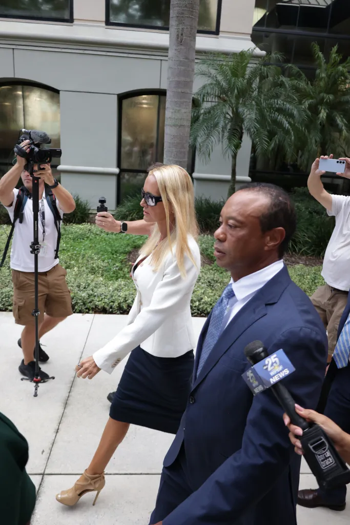 Tiger Woods and Vanessa Trump depart court.
