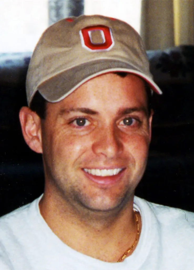 Todd Beamer, a passenger on United Airlines Flight 93, wearing a tan baseball cap with a red 