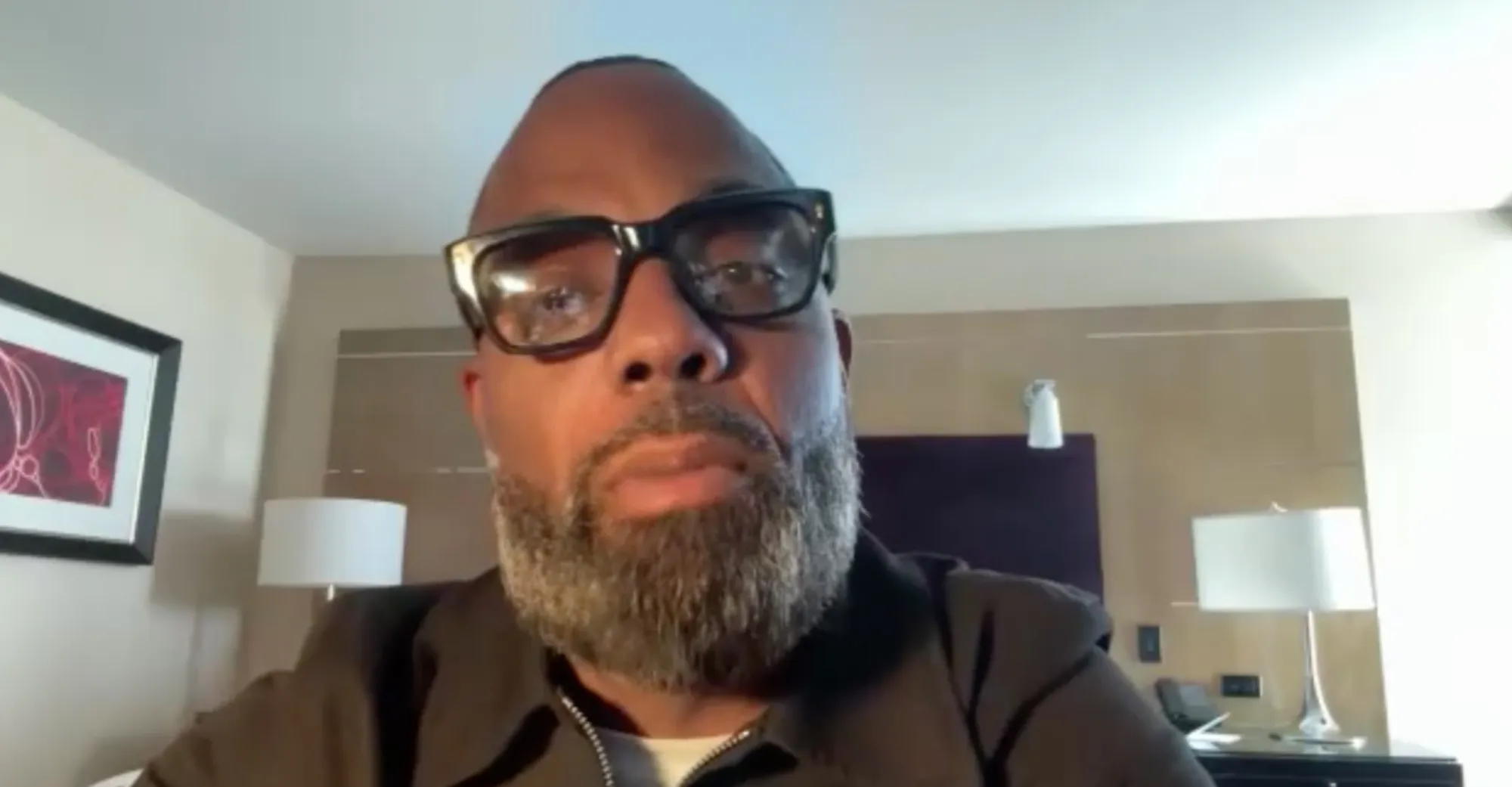 Todd Tucker speaking to the camera in a video conference.