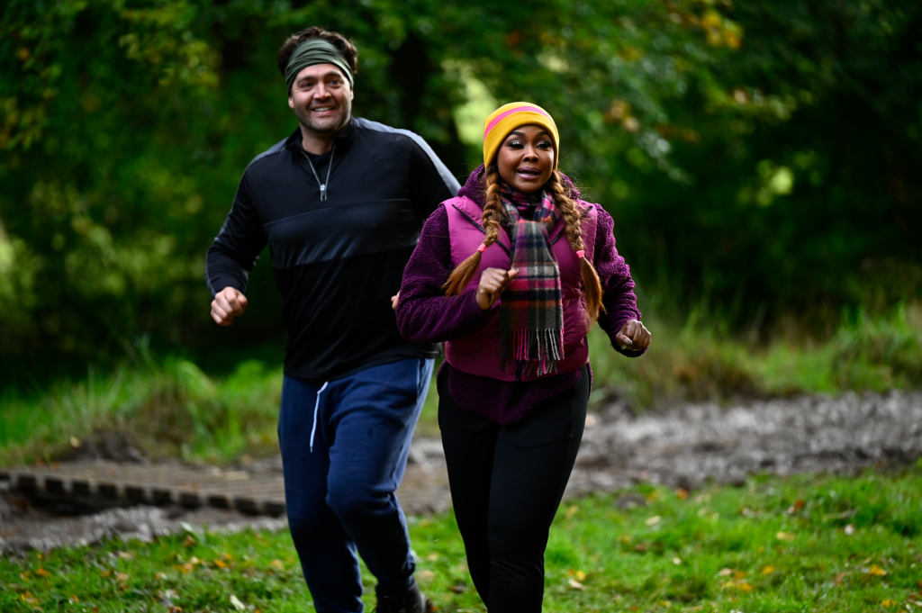 Chris 'C.T.' Tamburello and Phaedra Parks running outdoors.
