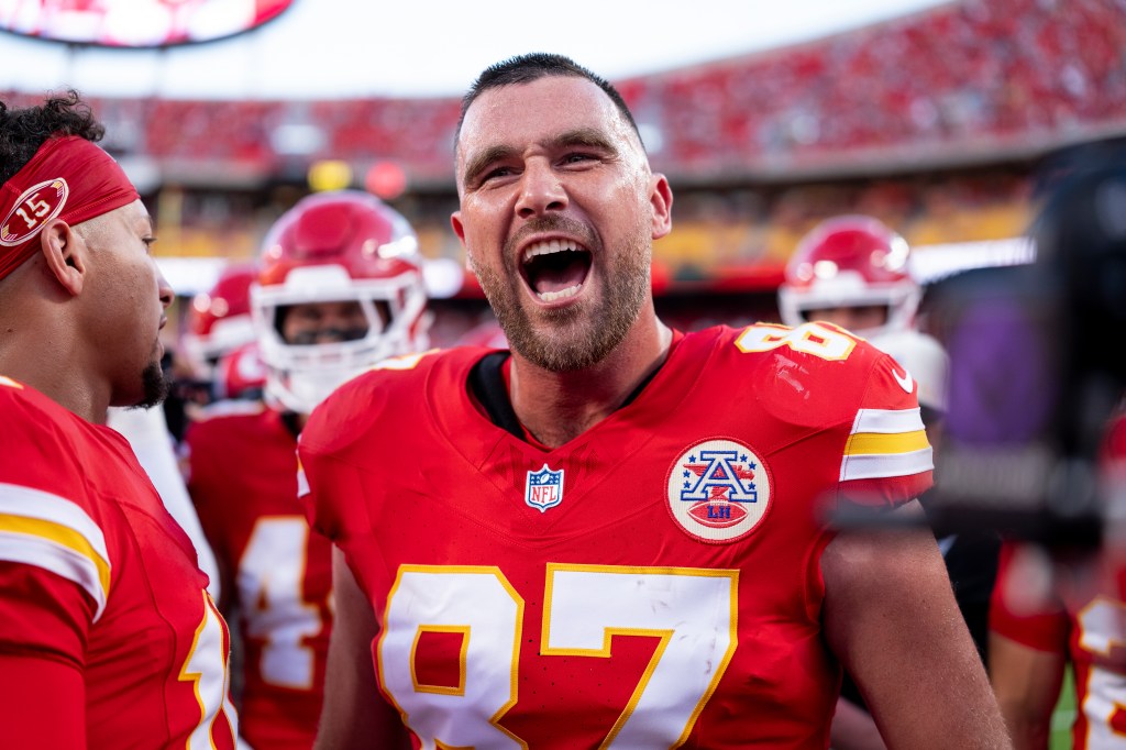 Travis Kelce of the Kansas City Chiefs in a huddle during an NFL game.