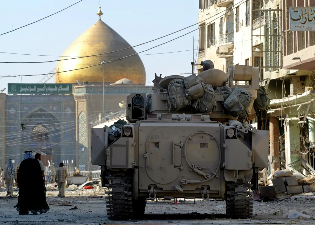 A U.S. Army Bradley armored vehicle guards a street leading to the Imam Ali shrine in Najaf, Iraq.