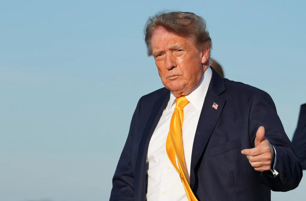 President Donald Trump gives a thumbs up.