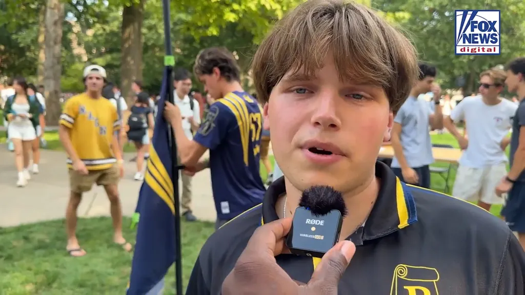 A University of Michigan student is interviewed on camera about freshmen having their first-semester grades hidden.