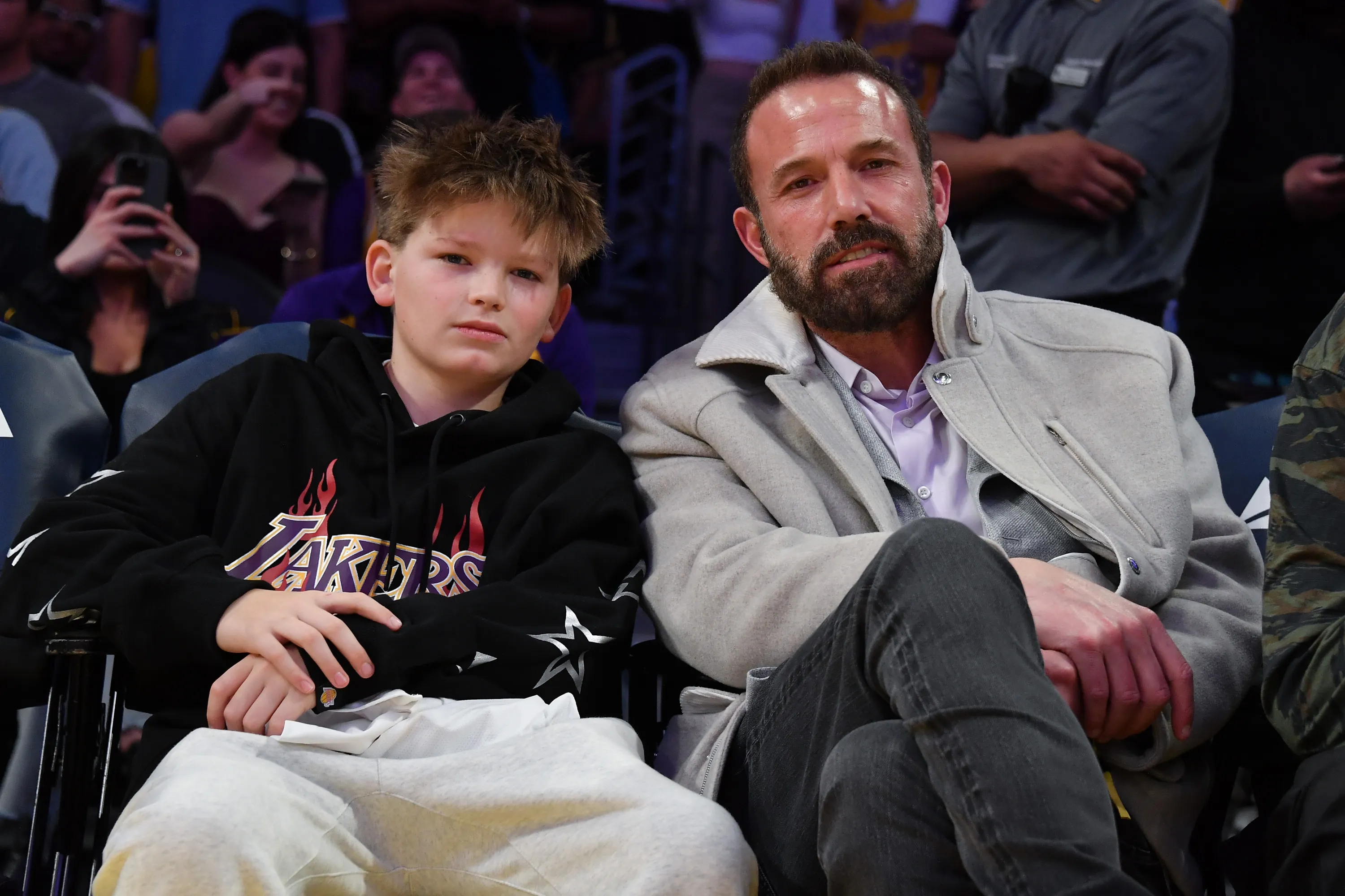 Ben Affleck and Samuel Garner Affleck watching a Lakers game.