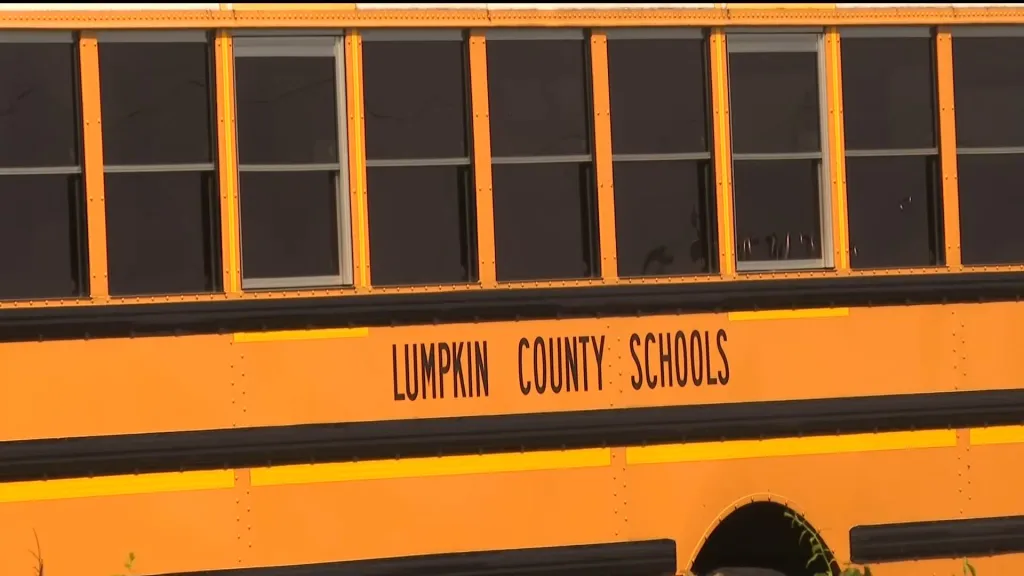 The sheriff's office issued arrest warrants Wednesday for three adults accused of boarding the bus and confronting the driver.