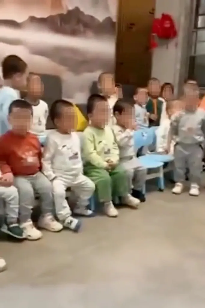 Video still of dozens of little boys shouting, “Daddy!”