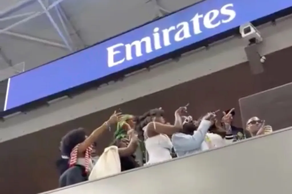 A group of influencers in a suite record a promotion at the US Tennis Open.
