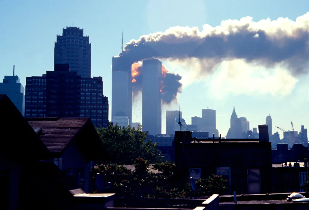 Flames and smoke erupt from the World Trade Center's South Tower after being struck by a plane.