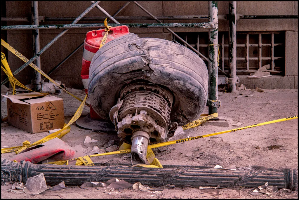 Damaged landing-gear wheel and brake assembly from American Airlines Flight 11, found on Rector Street, New York, among debris after the 9/11 attacks.
