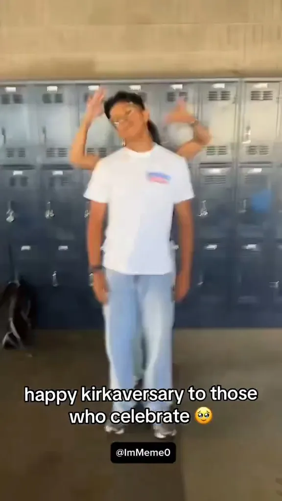 A person with glasses stands in front of lockers with text that reads 