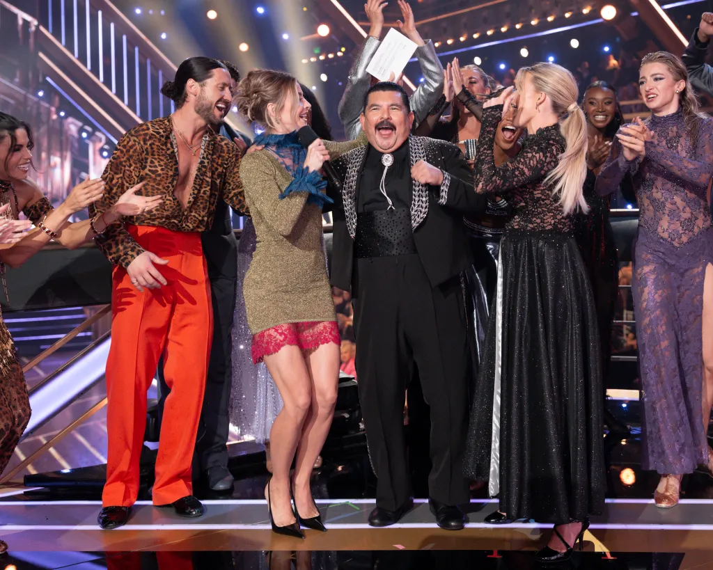 Guillermo Rodriguez celebrating with Dancing with the Stars contestants and judges.