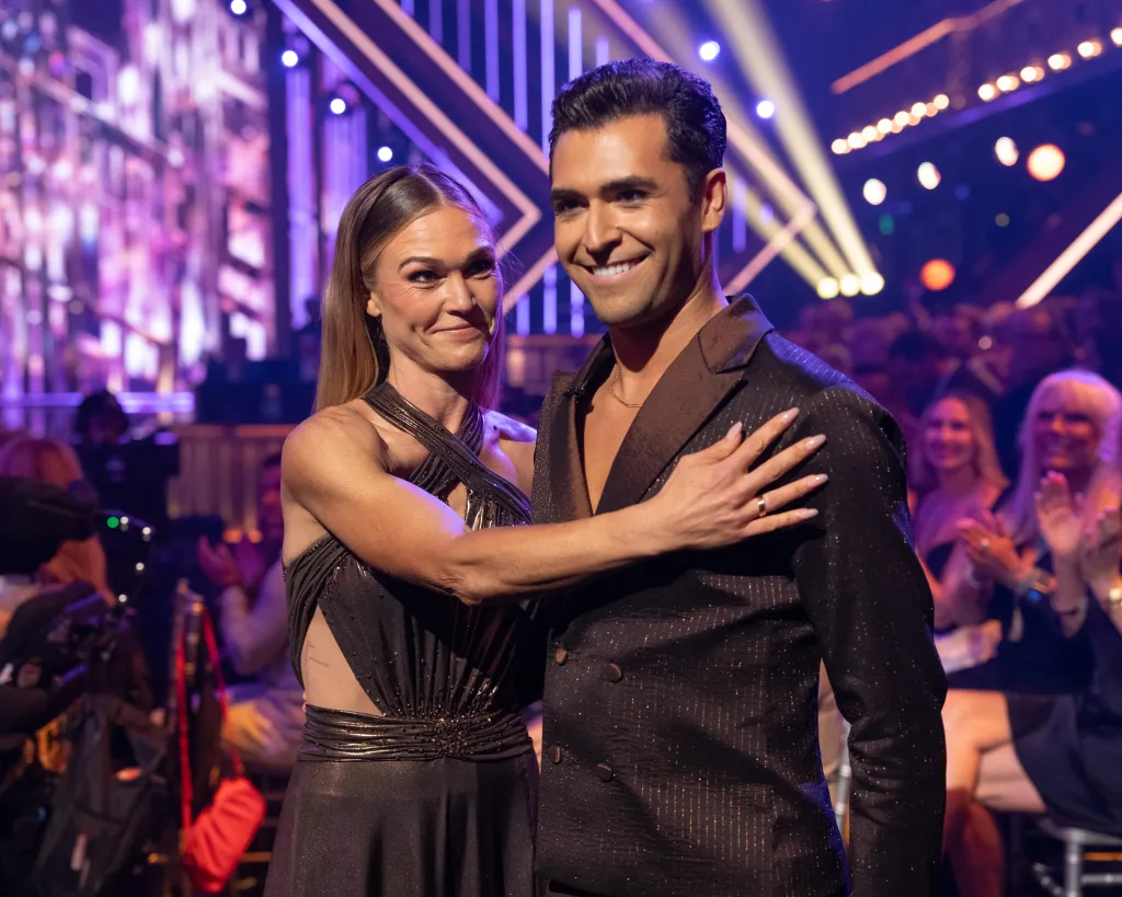 Julia Stiles and Ezra Sosa pose together on Dancing with the Stars.