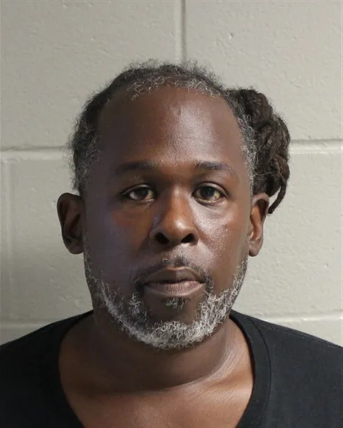 Travis Lathan White pictured after his arrest for the fatal Walmart attack in Norfolk, Virginia.
