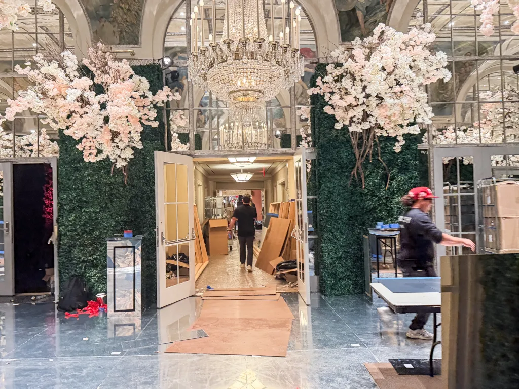 A wedding venue with cherry blossoms and a reflective floor is being prepared for the wedding of Alina Habba and Turhan Mildon.