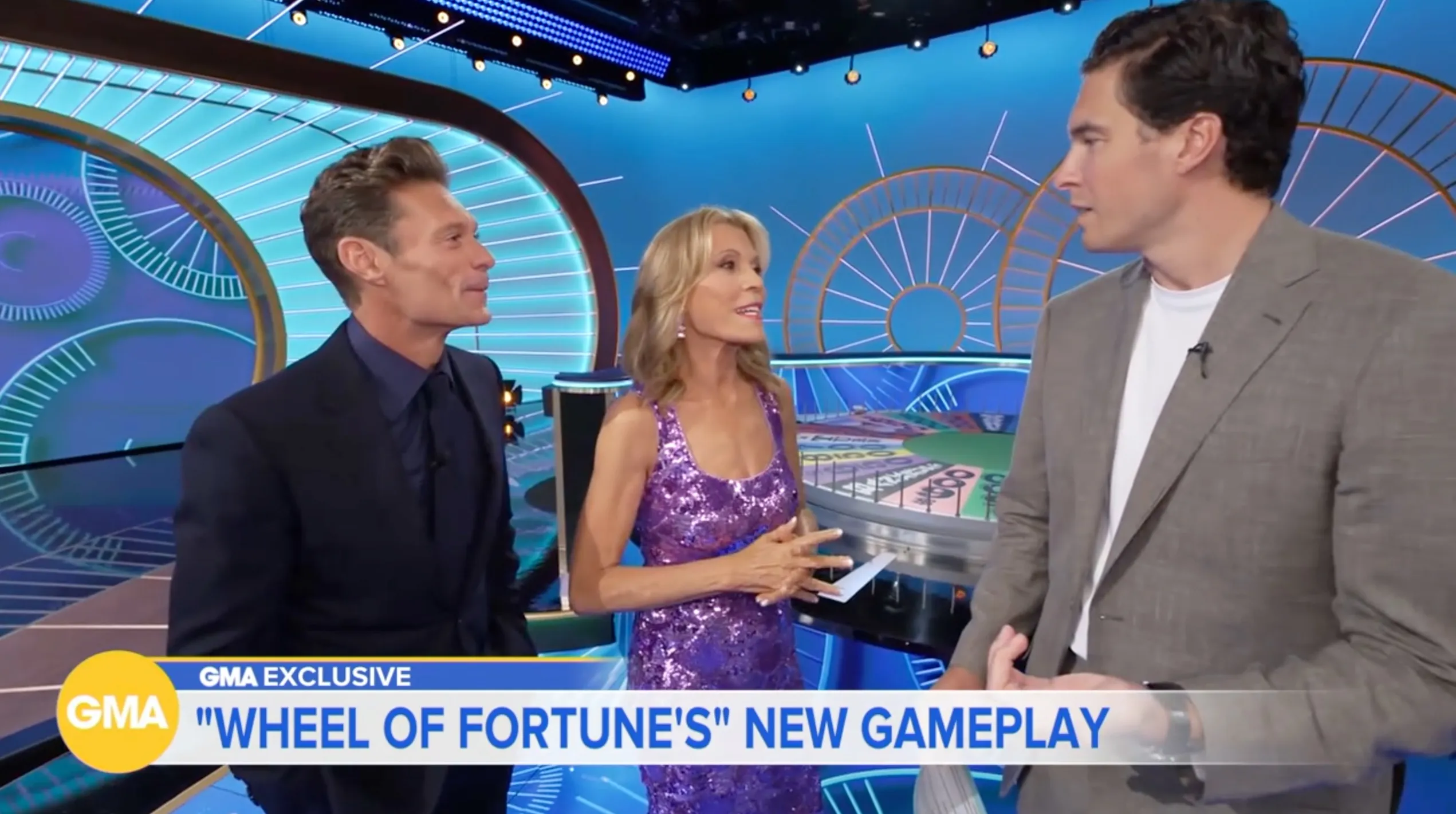Ryan Seacrest and Vanna White being interviewed about Wheel of Fortune.