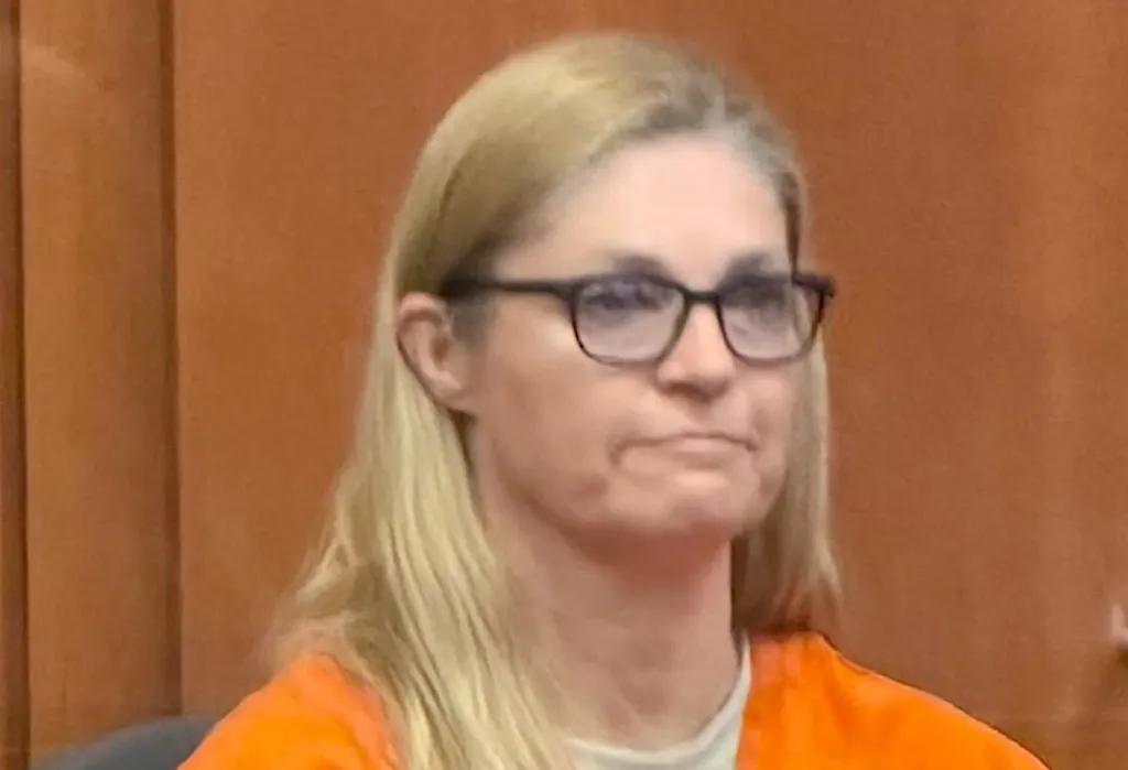 Lindsay Hansen smiling during her appearance at the Hall of Justice.