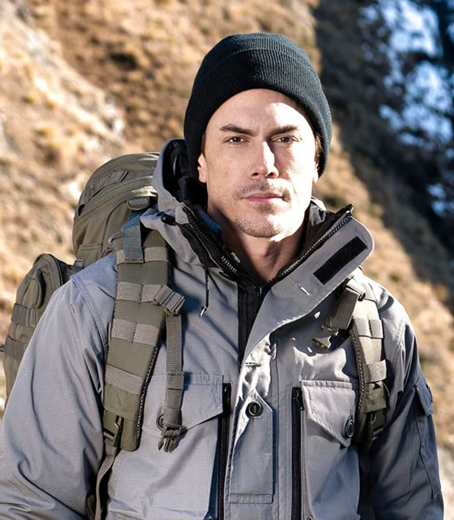 Tom Sandoval in a black beanie, grey jacket, and backpack for Special Forces: World’s Toughest Test.