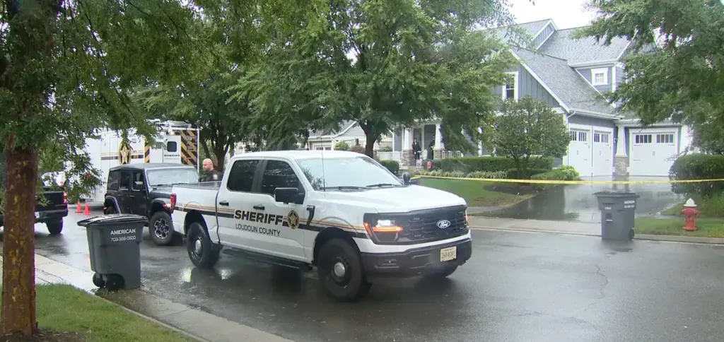 Loudoun County Sheriff's vehicles and personnel at a crime scene.