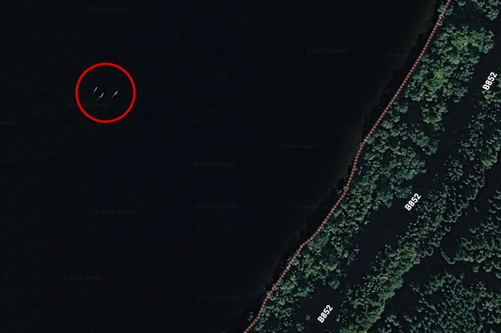 Satellite image showing three white shapes in Loch Ness, circled in red.