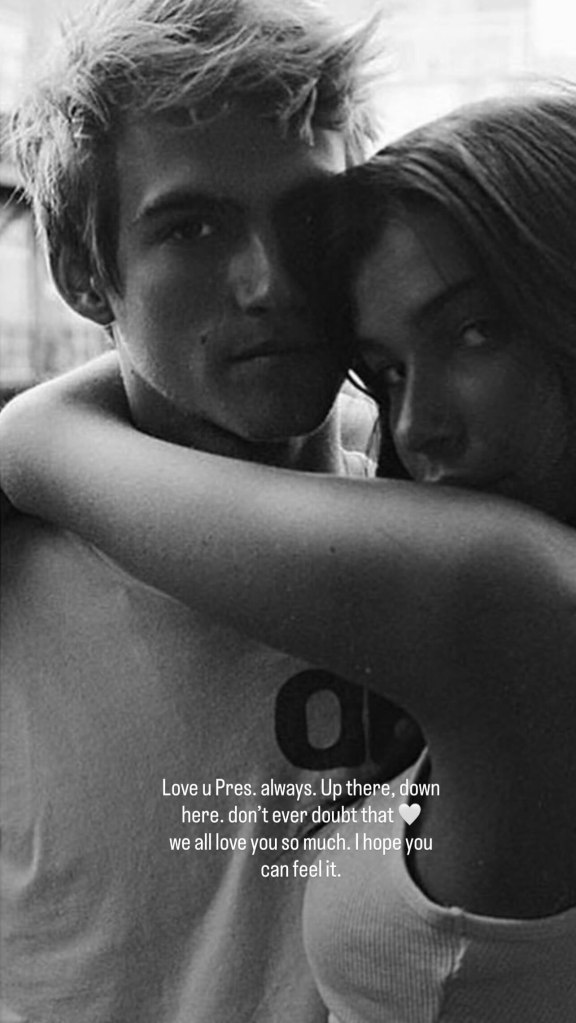 Black and white photo of a woman embracing a man from behind, with text that reads