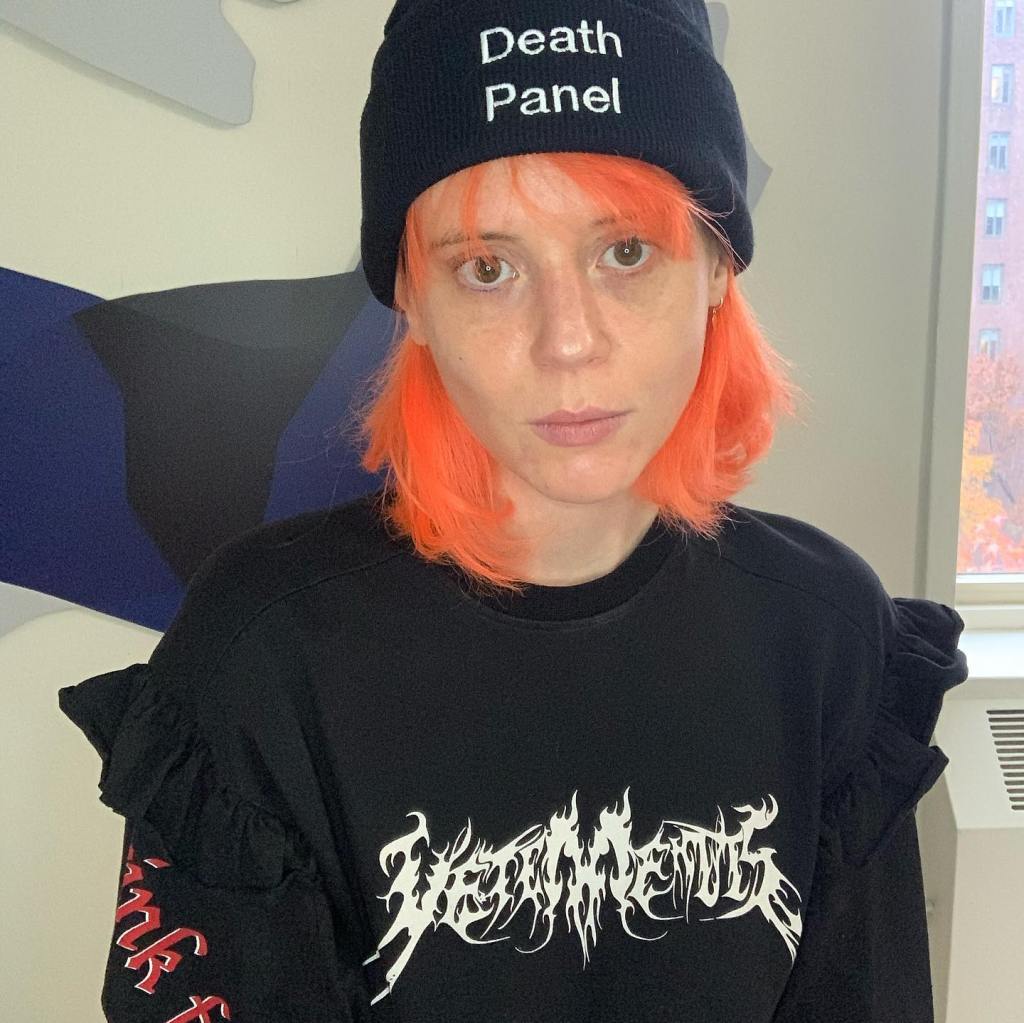 Beatrice Adler-Bolton with bright orange hair and a 