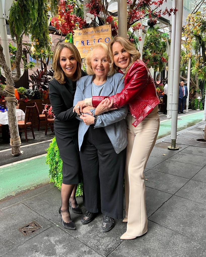 Rosanna Scotto, her sister Eliana, and their mother Marion embracing outdoors at Fresco by Scotto.