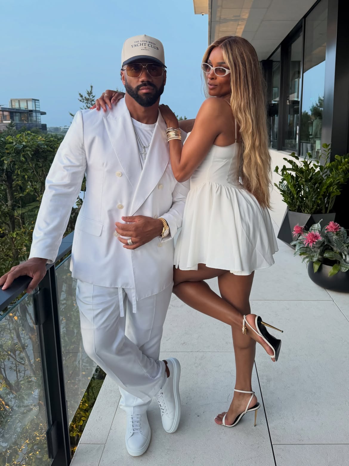 Ciara and Russell Wilson in all-white outfits for Michael Rubin's white party.