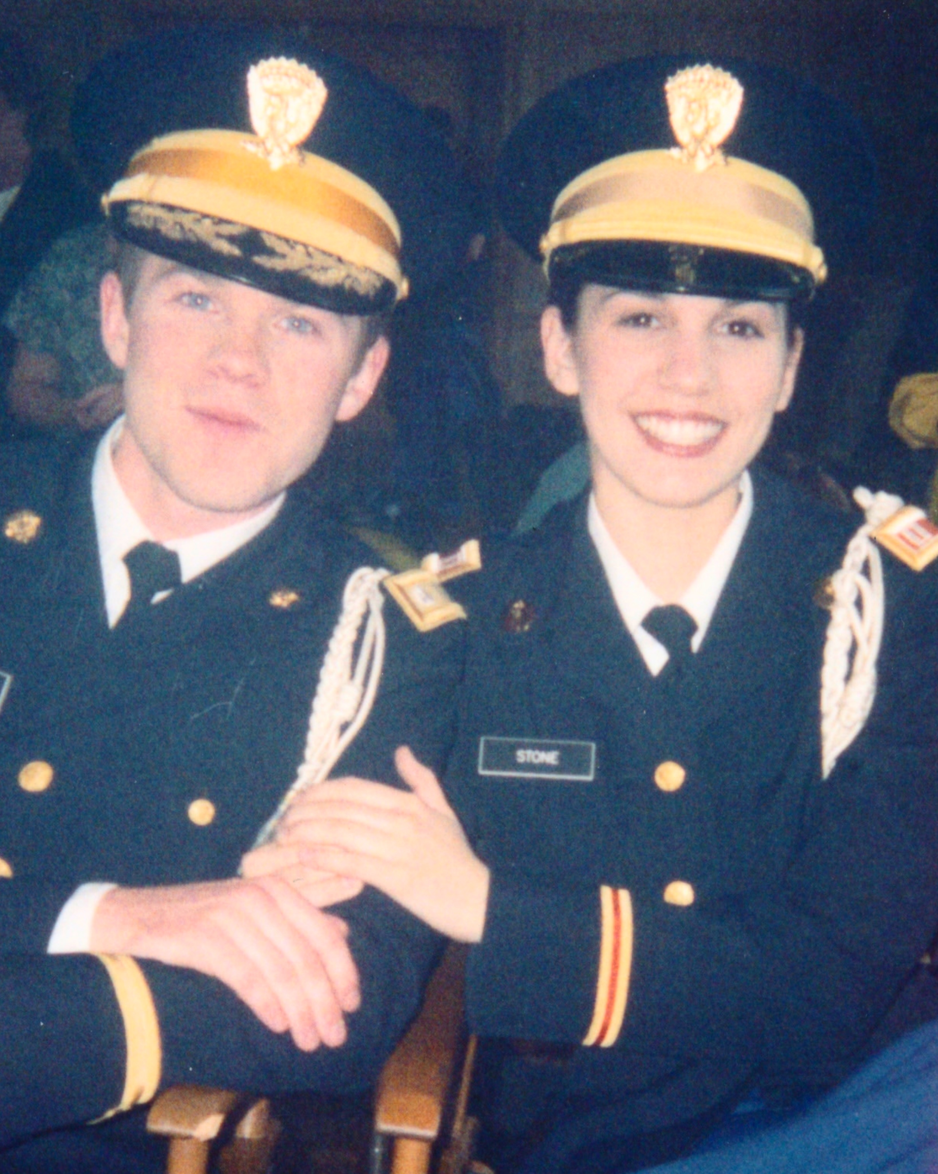 A young Shawn Ashmore and Christy Carlson Romano smiling while wearing military uniforms.