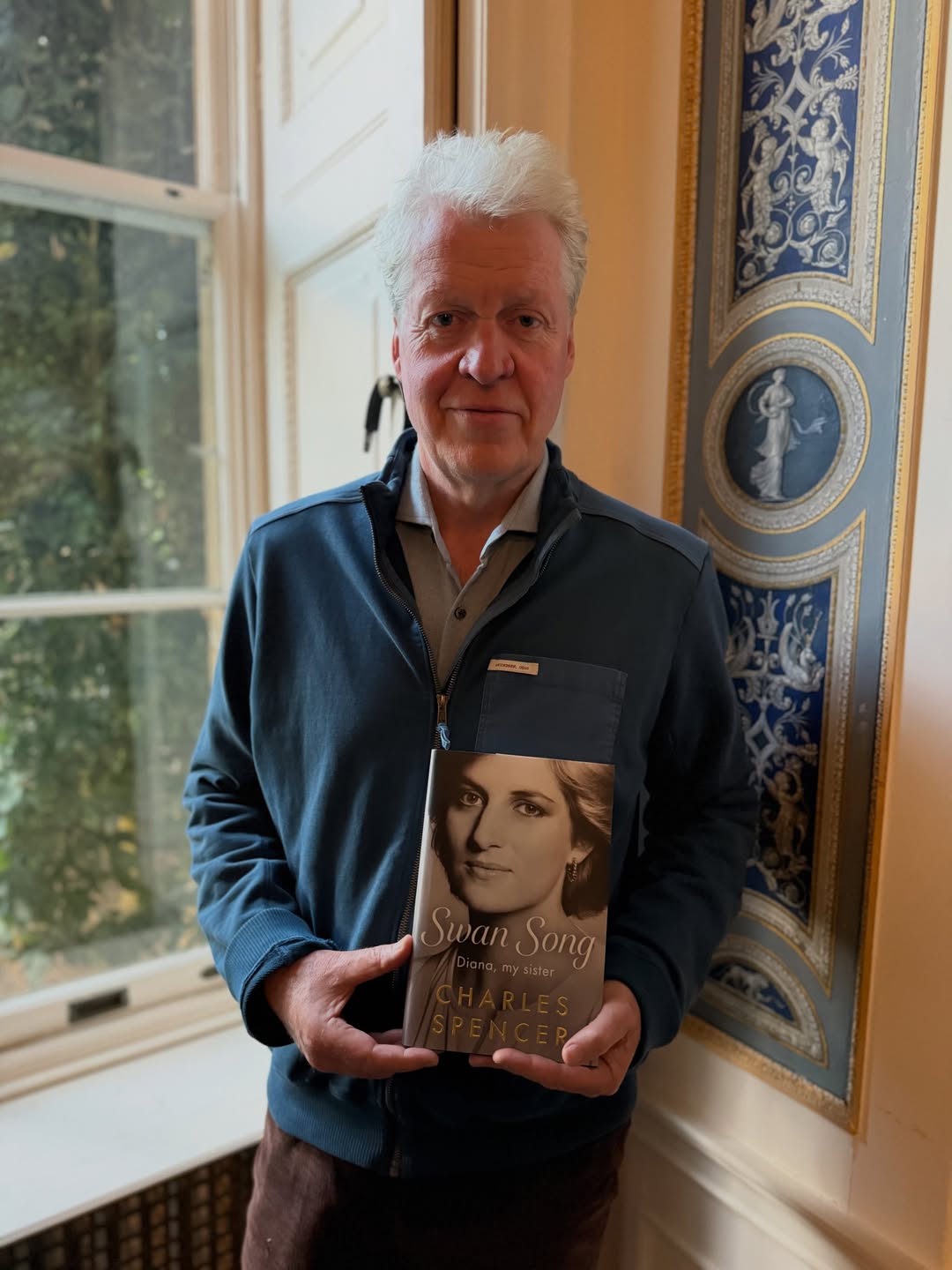 Charles Spencer with his book