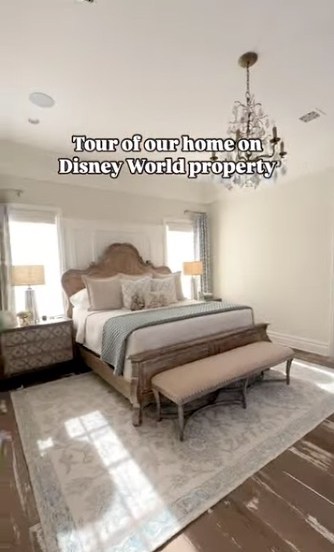 One bedroom pairs a four-poster bed with exposed beams and soft, neutral finishes.