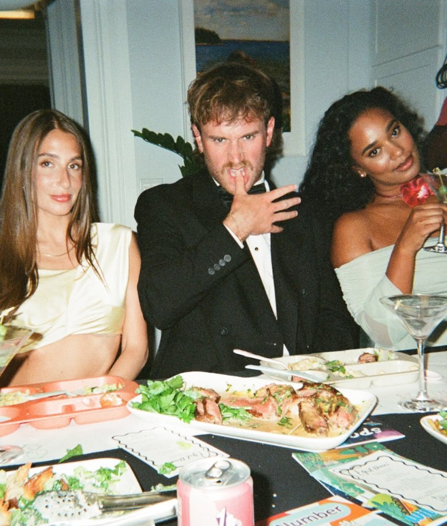 West Wilson and Amanda Batula with another woman at a dinner table.