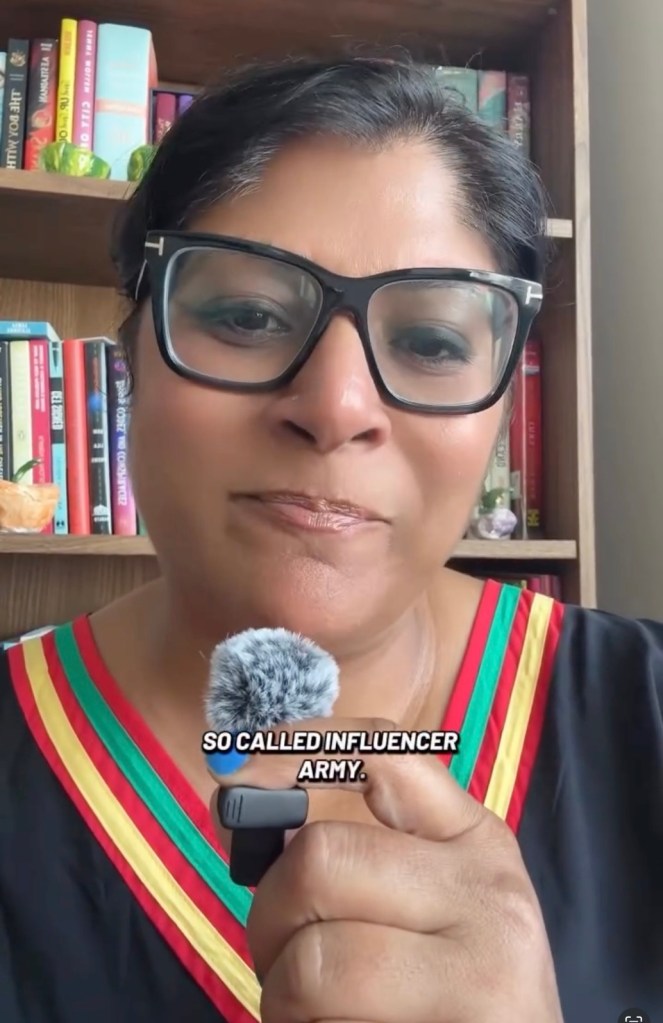 Miral Sattar, a Mamdani influencer, speaks into a fluffy microphone, with a bookshelf visible in the background.