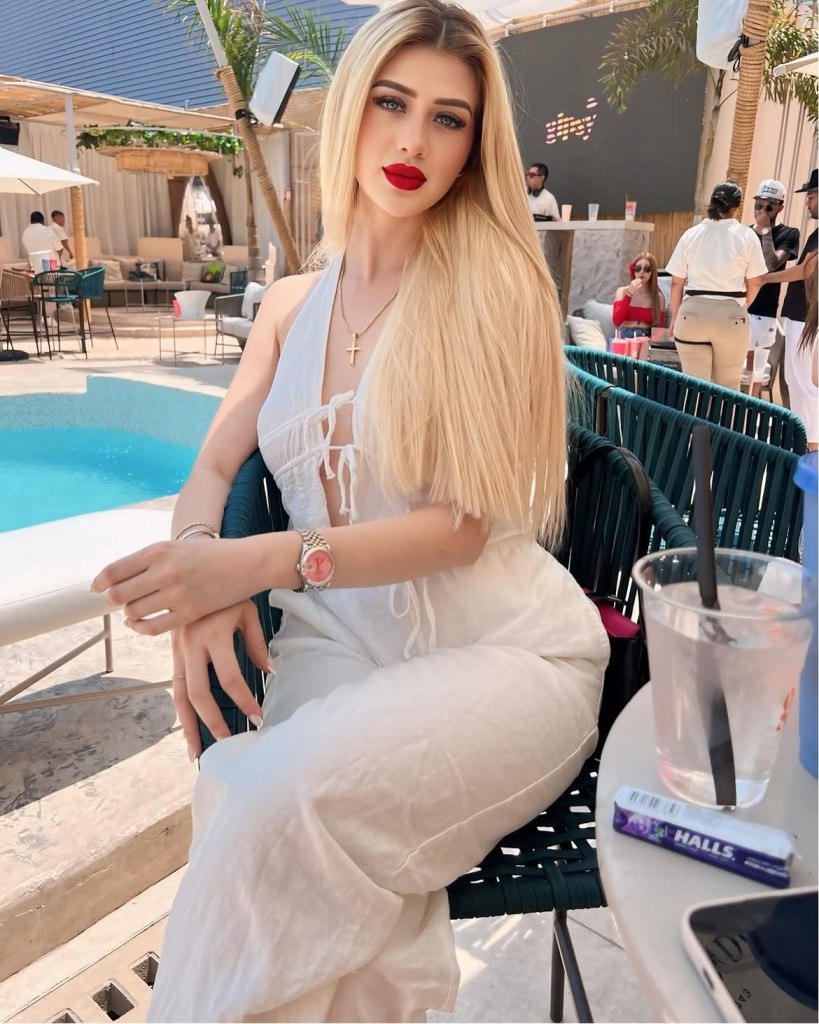 Valeria Marquez seated outdoors beside a pool.
