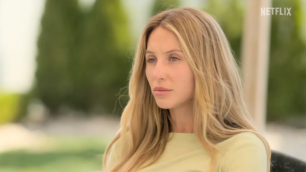Alix Earle in a light green top.